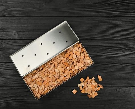 stainless steel vs cast iron wood chip box|Smoker Tubes vs. Smoker Boxes: The Ultimate .